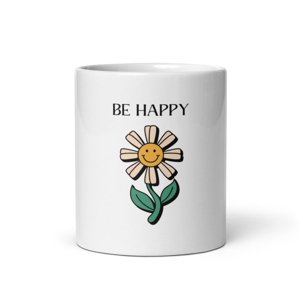 Be Happy Daisy Mug, white ceramic mug with a cheerful daisy illustration and "Be Happy" text, front view on plain background.